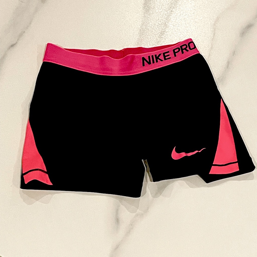 Pink and black Nike Pros